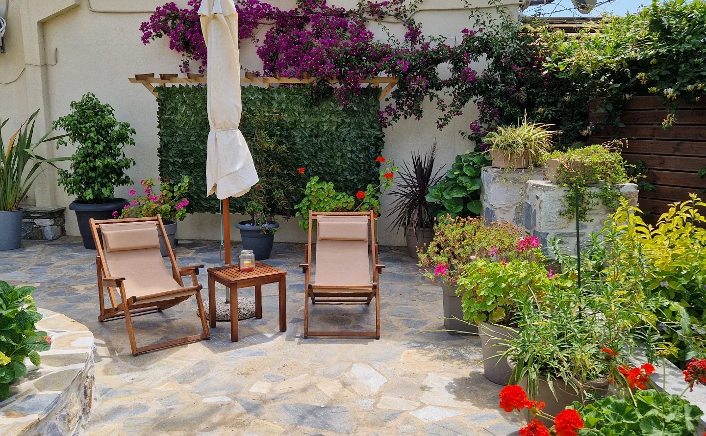 Deckchairs on the flowered stone patio
