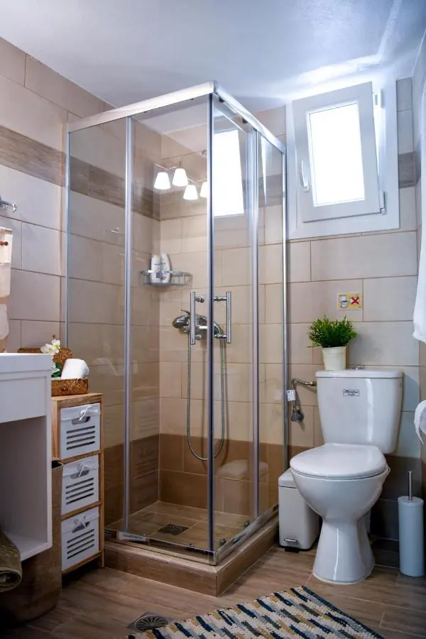 The bathroom with glass shower