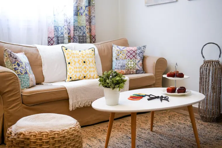 The living room: sofa, coffee table and pouffe