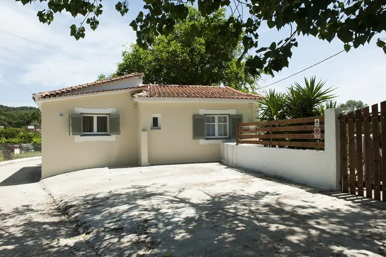 The paved yard beside the house