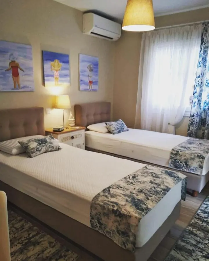 Two single beds and air conditioning in the second bedroom