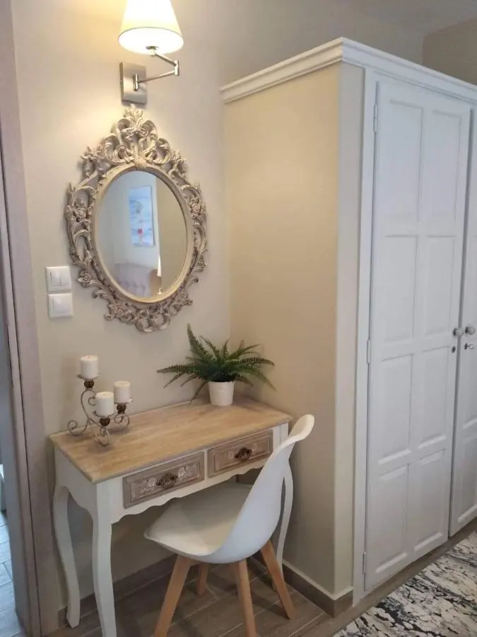 Wardrobe and a desk with an ornate mirror