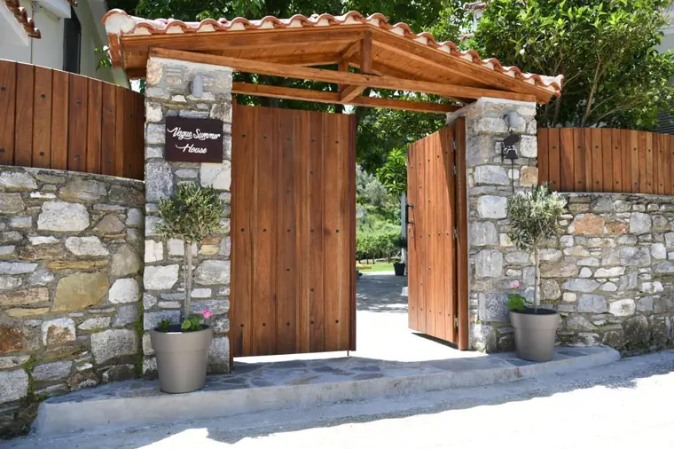 The wooden gate in the stone wall